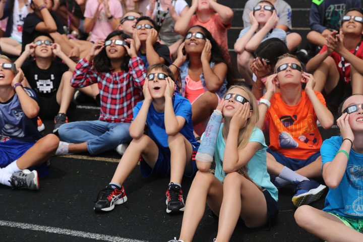 Students at Clay Middle School look at the eclipse. It was impossible to see at times because of cloud cover. (Photos by Ann Marie Shambaugh)