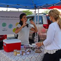 Akshaya That of Zionsville talks about her product to Teresa Peterson at the Pop Up Farmers' Market. (Photo by Dawn Pearson)