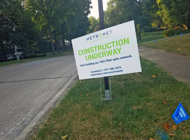 A MetroNet sign alerting Carmel residents to construction in the area remains standing after the city ordered the company to halt work after its subcontractors broke several gas lines. (Photo by Ann Marie Shambaugh)