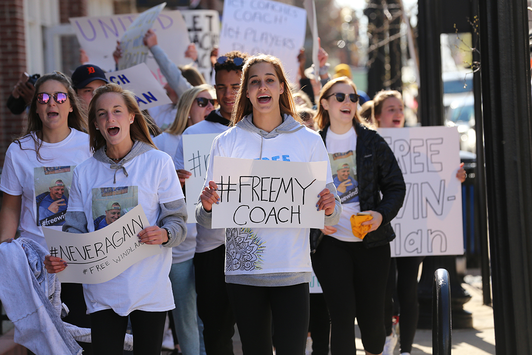 Supporters of former Carmel High School girls basketball coach Tod Windlan march through downtown Carmel April 28. (Photo by Ann Marie Shambaugh)