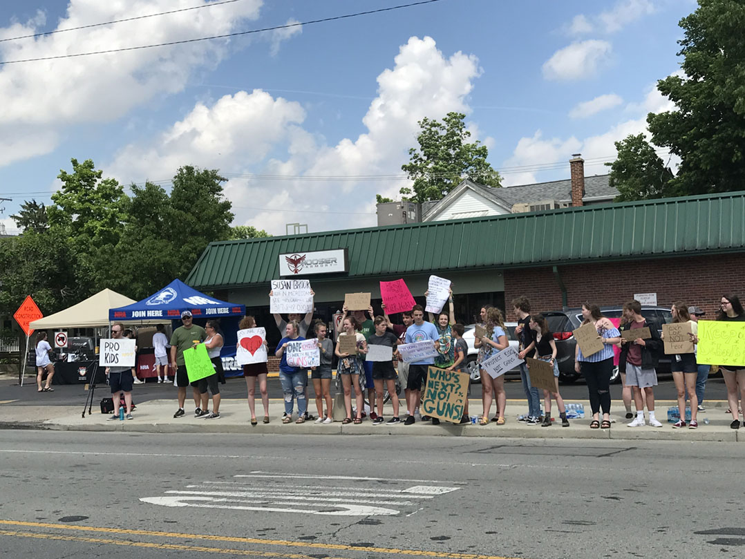 A protest is under way at Hoosier Armory at the southeast corner of 10th and Logan streets in downtown Noblesville. The store is holding its grand opening today. Approximately 50 are on site.