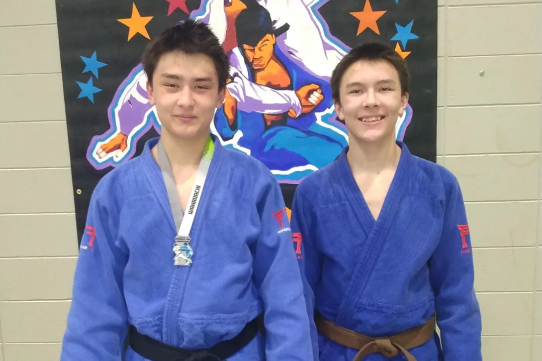 Saint Cramer, left, and his brother, Arch, at a Judo tournament. Saint earned a silver medal. (Photo courtesy of Daniel Cramer)