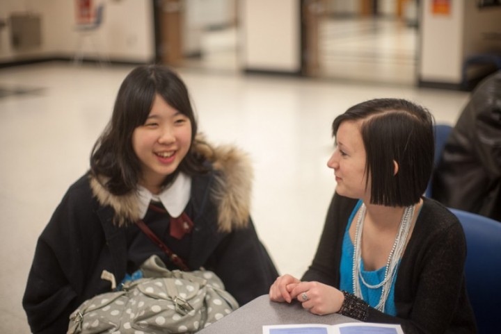 Exchange student Maika Saigoh chats with her host, Carmel High School student Claire McAllister during the exchange in 2013. (Photo by Sam Patterson for HILITE magazine at CHS.)