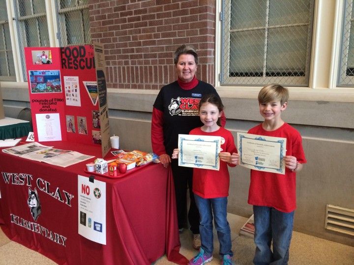 Lauren Clay and Briggs Griffin with cafeteria manager Beth Galloway took first place in K-4 division of the Eco Science Fair on March 20. Clay and Griffin won tickets to an Indianapolis Indians game and received certificates for their presentation to the judges.������������������
