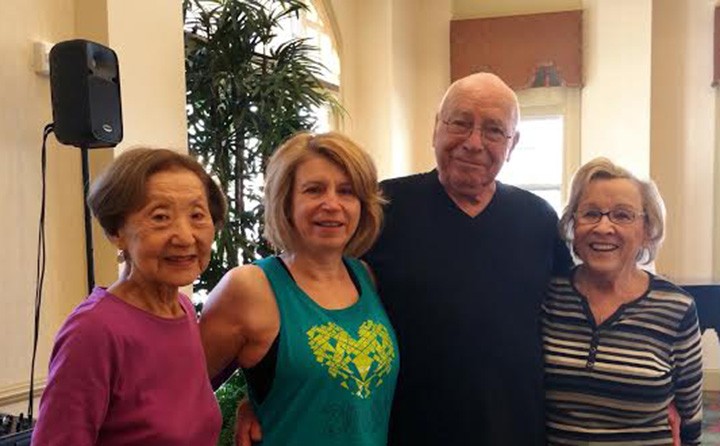 From left: Resident Jean Umemura, officer Nancy Zellers, and residents Bob Stoup with his wife Juli Hall pose before their workout. Zellers, a police officer, teaches Zumba every Saturday. (Submitted photo)